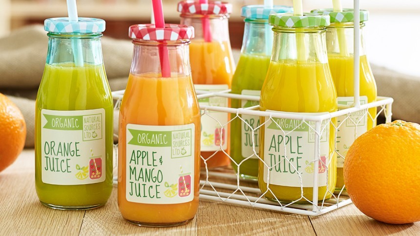 Variety of different juices in small bottles