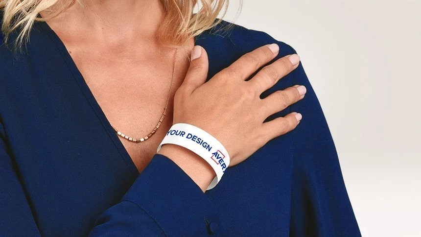 Identification band with Avery logo on the wrist of a woman