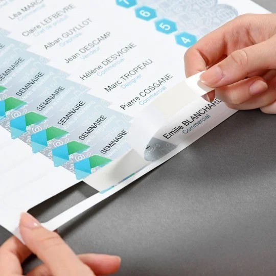 Peeling the name tags off the sheet