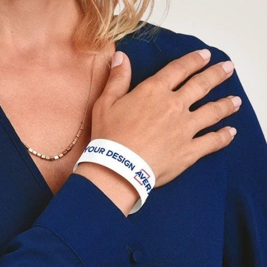 Identification band with Avery logo on the wrist of a woman
