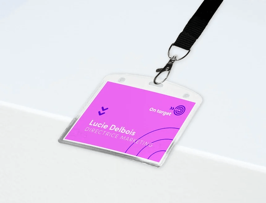 Purple badge in a square case with information about the conference participant